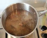 A picture of step 1 of Brothy rice with prawns and squid.