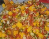 A picture of step 2 of Mango pico de gallo salsa.