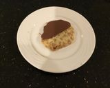 A picture of step 9 of Milk Chocolate Dipped Toffee Shortbread Cookies.