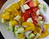 A picture of step 2 of Greek salad with ranch dressing.