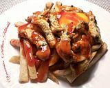 Foto del paso 15 de la receta Tiras de muslos de pollo, con patatas fritas y huevos