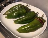 Une image de l'étape 6 de Poivrons cornes farcis au porc et tomates.