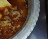 A picture of step 11 of Mughlai koftay anday aloo ka salan.