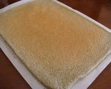 A picture of step 8 of Rich Black Sesame Roll Cake.