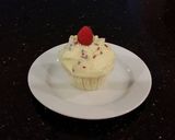 A picture of step 24 of White Chocolate Truffle Cupcakes with Whipped White Chocolate Mascarpone Frosting.