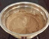 A picture of step 7 of Chocolate Layer Cake with Strawberry Cream Filling, White Chocolate Ganache Frosting coated with a Chocolate Crumble.