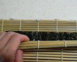 A picture of step 12 of Salad Roll (with rolling instructions).