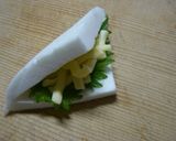 A picture of step 3 of Melting Hanpen with Shiso and Cheese.