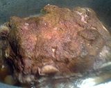 A picture of step 6 of Boston butt stuffed with shallots stove top.