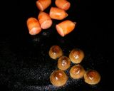 A picture of step 2 of Bento Acorns with shimeji mushrooms and wiener sausages.