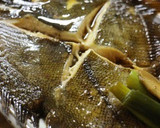 A picture of step 7 of Easy Simmered Flounder in a Frying Pan.