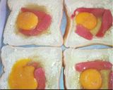 A picture of step 1 of Cheesy egg in a hole baked toast.