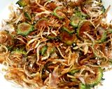 A picture of step 1 of Crispy bitter gourd and onion fry.