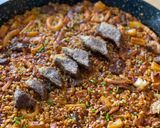 Foto del paso 7 de la receta: Paella de pluma ibérica y calamar