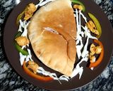 A picture of step 4 of Chicken masala in pita bread.