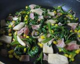 A picture of step 5 of Spinach and King Oyster Mushrooms Sauteed With Butter and Soy Sauce.