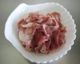A picture of step 1 of Pork and Shungiku Chrysanthemum Greens Brown Sugar Stir-Fry.