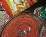 A picture of step 1 of Hot cheeto mozzarella sticks (CheezOs).