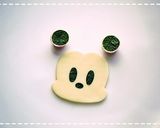 A picture of step 2 of Mickey and Minnie Onigiri Character Bento.