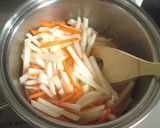 A picture of step 5 of Comforting Simmered Daikon Radish, Carrot and Aburaage.