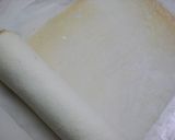 A picture of step 14 of Pure White Roll Cake.