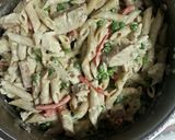 A picture of step 8 of Chicken Penne Alfredo with veggies and homemade sauce.