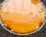 A picture of step 3 of Rava kesari with dessicated coconut and toasted sesame.
