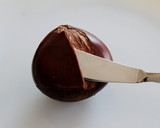 A picture of step 4 of Peel the Outer Shells of Chestnuts with a Paring & Butter Knife.