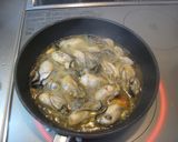 A picture of step 5 of Simple Oyster Ajillo (Simmered in Oil).