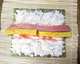 A picture of step 7 of Doll's Festival Seafood Futomaki Sushi Rolls with Nanohana.