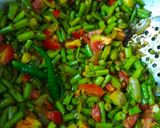 A picture of step 4 of Barbati Tomato Kura or Yard Beans with tomato.