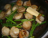 A picture of step 3 of Scallops and Asparagus Stir-fried in Lemon, Butter and Soy Sauce.