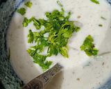 A picture of step 1 of Dahi Tadka.