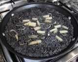 A picture of step 10 of Paella with Squid and Squid Ink.