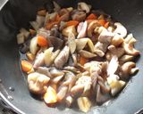 A picture of step 4 of Chikuzen-ni (Stewed Chicken with Root Vegetables).