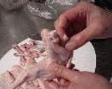 A picture of step 1 of Chicken Wing Gyoza (with chicken de-boning instructions).
