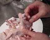 A picture of step 1 of Chicken Wing Gyoza (with chicken de-boning instructions).