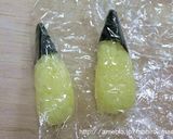 A picture of step 4 of Pokemon Character Bento - Pikachu Onigiri.
