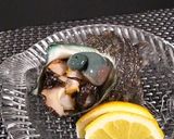 A picture of step 9 of Fresh Turban Shell Sashimi.