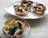 A picture of step 6 of Cheese and Blueberry Honey Cups.