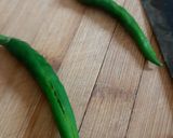 A picture of step 1 of Vadhvani Green Chilli Pickle (Hari Mirchi Ka Achaar).