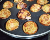 A picture of step 4 of Moong Dal Appe with vegetables.