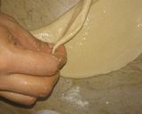 A picture of step 9 of Lacha Dar Paratha in layers of three kind.