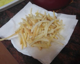 Foto del paso 9 de la receta: Jamoncitos de pollo adobados y asados en freidora de aire con salsa de Cola-Cola y papas fritas