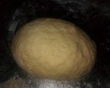 A picture of step 3 of Bow tie buns.