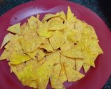 A picture of step 5 of Doritos (nachos chips) in cheese sauce.