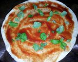 A picture of step 2 of Tortilla pizza.