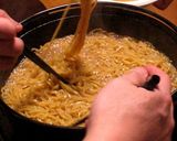 A picture of step 8 of A Hakata Specialty: Soy Sauce Based Motsu Hot Pot.