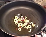 A picture of step 3 of Authentic Garlic Chicken in a Frying Pan.