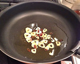 A picture of step 3 of Authentic Garlic Chicken in a Frying Pan.